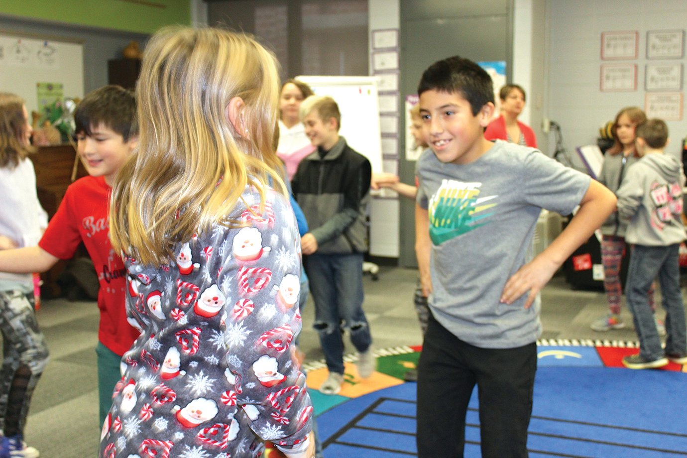 Darrick Fuentes, fourth grader at Ladoga Elementary, looks to his partner ahead of Instructor Jennifer Ellingwood's directions during music class Thursday.
